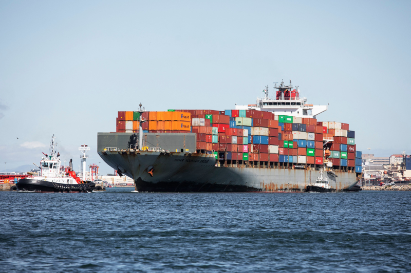 A container ship moves out of Cape Town commercial harbor.