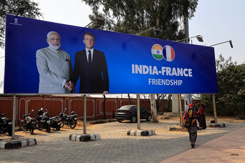 A billboard is seen ahead of French President Emmanuel Macron’s visit to India in Jaipur, India, on Jan. 24.