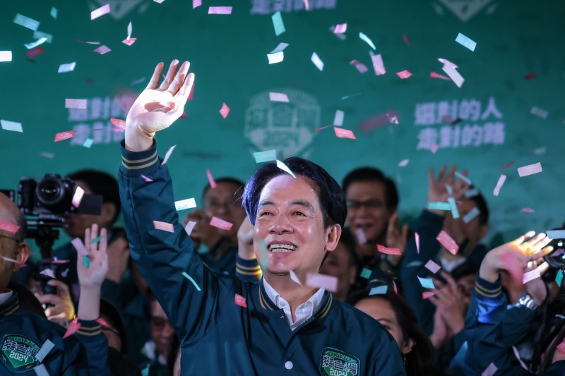 Confetti falls as Taiwanese President-elect Lai Ching-te speaks to supporters at a victory rally in Taipei.