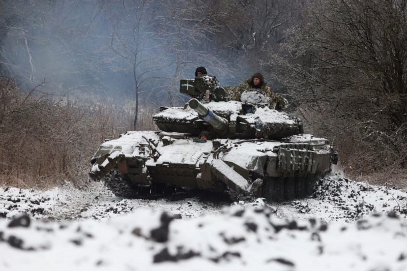 Ukrainian soldiers drive a tank close to the front near Bakhmut in the Donetsk region of Ukraine, on Dec. 13, 2023.