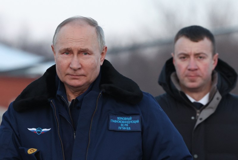 In this pool photograph distributed by Sputnik, Russian President Vladimir Putin looks on after flying on a Tupolev Tu-160M strategic bomber in Kazan, Russia, on Feb. 22.