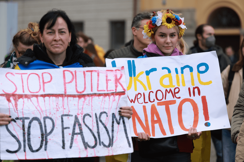 Demonstrators hold signs in support of Ukraine during a rally in Munich. One sign reads: "Ukraine welcome in NATO."