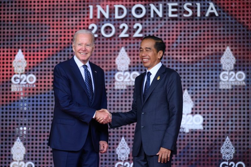 U.S. President Joe Biden is greeted by Indonesian President Joko Widodo at the start of the G-20 summit on Bali, Indonesia, on Nov. 15, 2022.