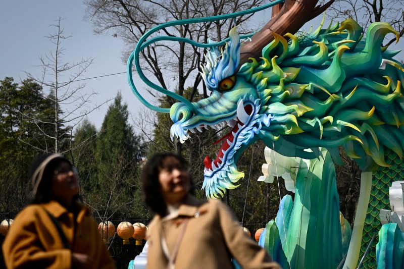 Visitors walk past a dragon installation at a Lunar New Year fair in Chengdu, China, on Feb. 17.