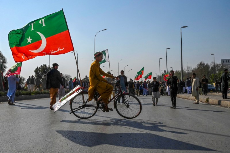 Pakistan Tehreek-e-Insaf party supporters block a highway with a protest in Peshawar, Pakistan, on Feb. 11.