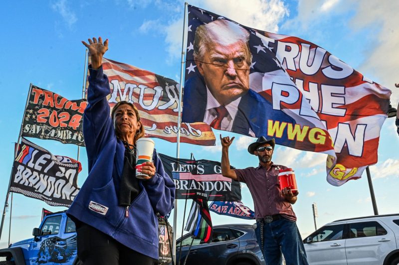Supporters of former U.S. President Donald Trump gather near Mar-a-Lago Club in Palm Beach, Florida, on March 21, 2023.