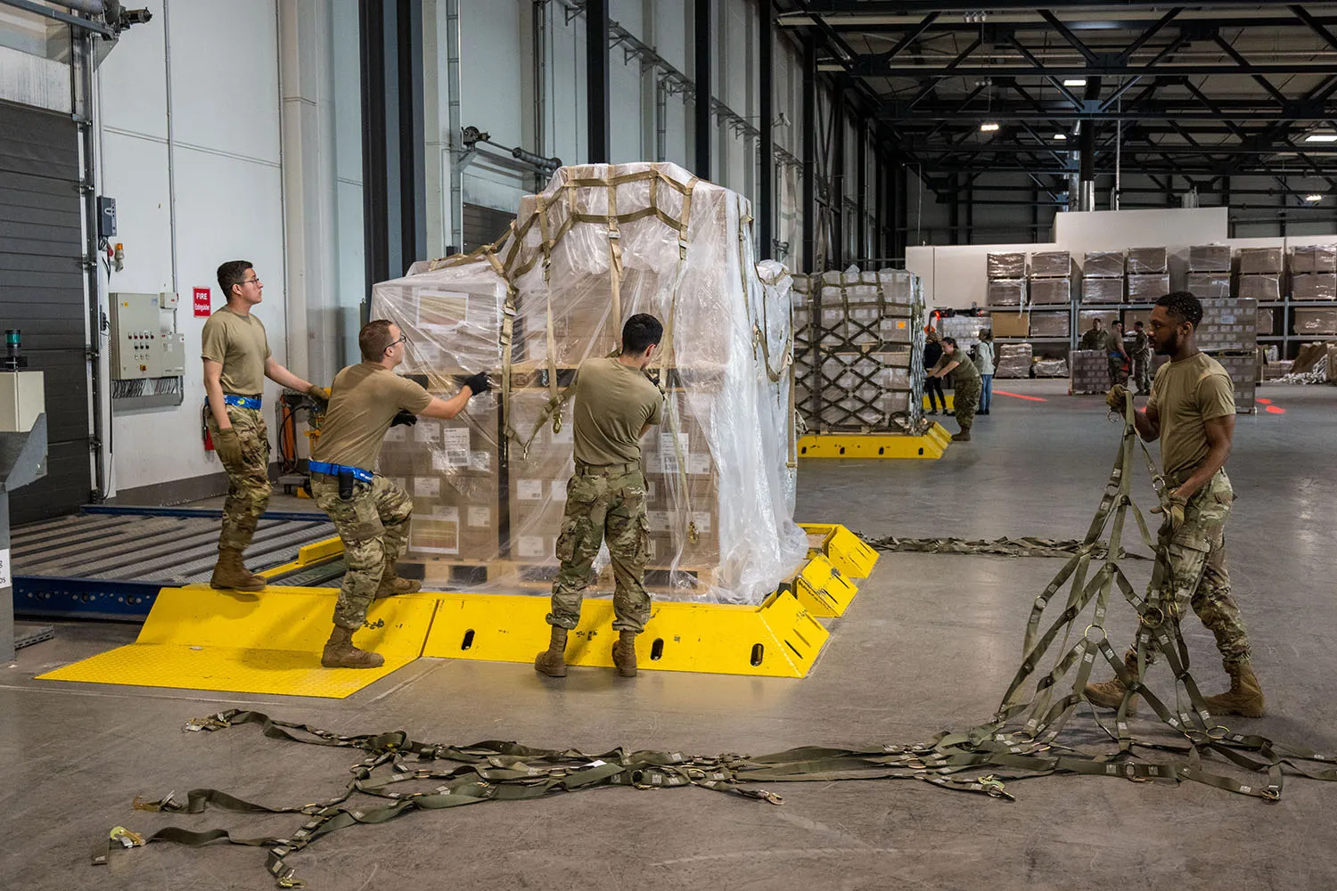 U.S. airmen load pallets with baby formula bound for the United States.