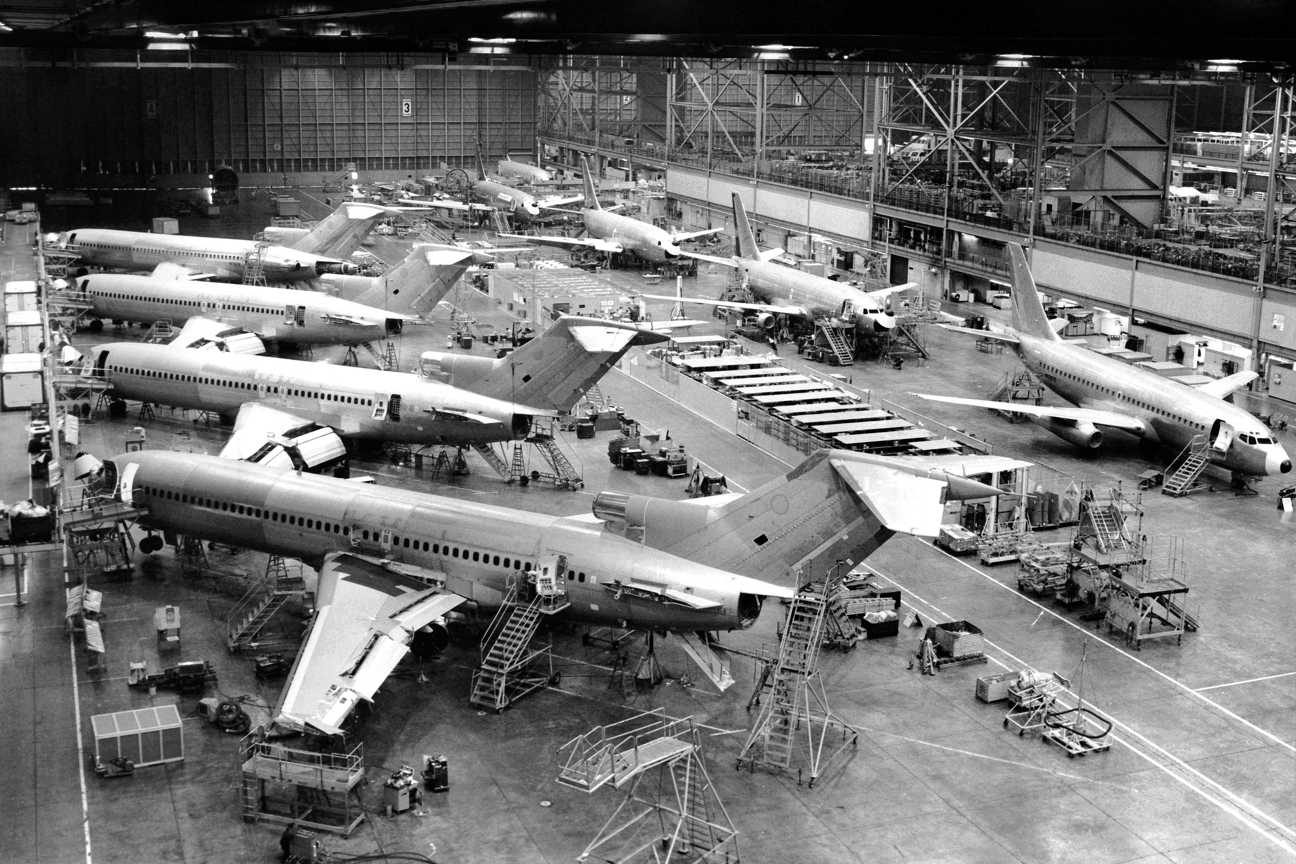 A historic image shows planes being built at a Boeing plant.