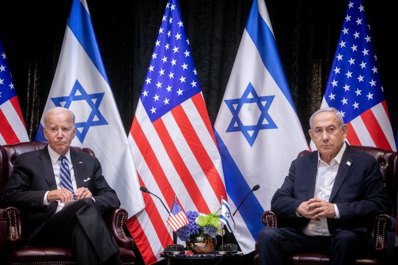 Israeli Prime Minister Benjamin Netanyahu confers with Defense Minister Yoav Gallant during their meeting with U.S. President Joe Biden in Tel Aviv.