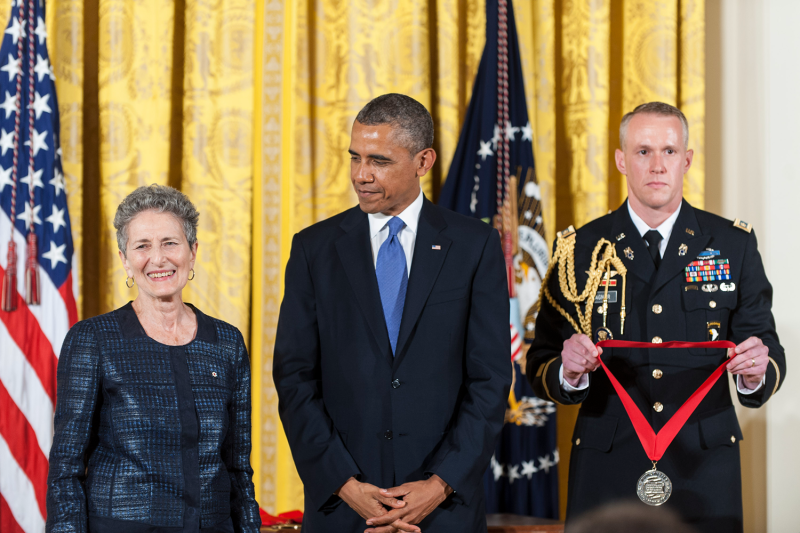 President Barack Obama (C) presents a 2012 National Humanities Medal to Canadian and American historian Natalie Zemon Davis (L) during a ceremony in the East Room of the White House on July 10, 2013 in Washington, DC.