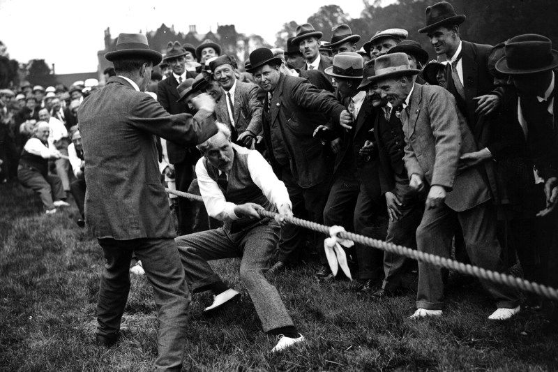 British Labour leader Ramsay MacDonald takes part in a tug-of-war match at a Labour Party gathering.
