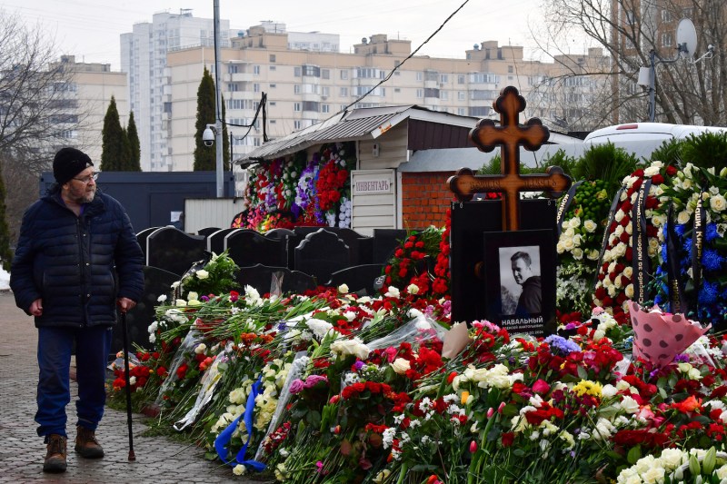 A man walks past the grave of Russian opposition leader Alexei Navalny at the Borisovo cemetery in Moscow.