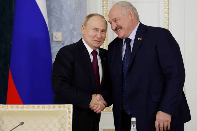In this pool photograph distributed by Russian state news agency Sputnik, Russian President Vladimir Putin and Belarusian President Aleksandr Lukashenko attend a meeting of the Supreme State Council of the Union State of Russia and Belarus, seen in Saint Petersburg on Jan. 29.