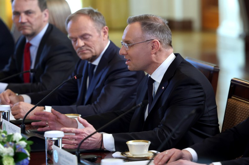 Polish President Andrzej Duda (R), seated next to Prime Minister of Poland Donald Tusk (C), participates in a meeting with U.S. President Joe Biden at the White House on March 12 in Washington.