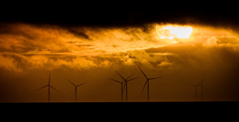 The sun sets over the first offshore wind farm in France, off the coast of the western city of Saint-Nazaire.