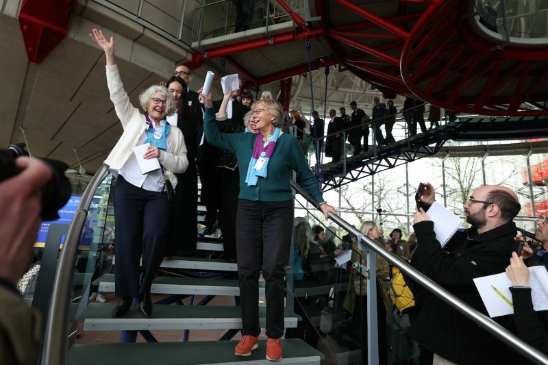 Members of the Senior Women for Climate Protection group react after hearing the decision on a climate change case at the European Court of Human Rights.