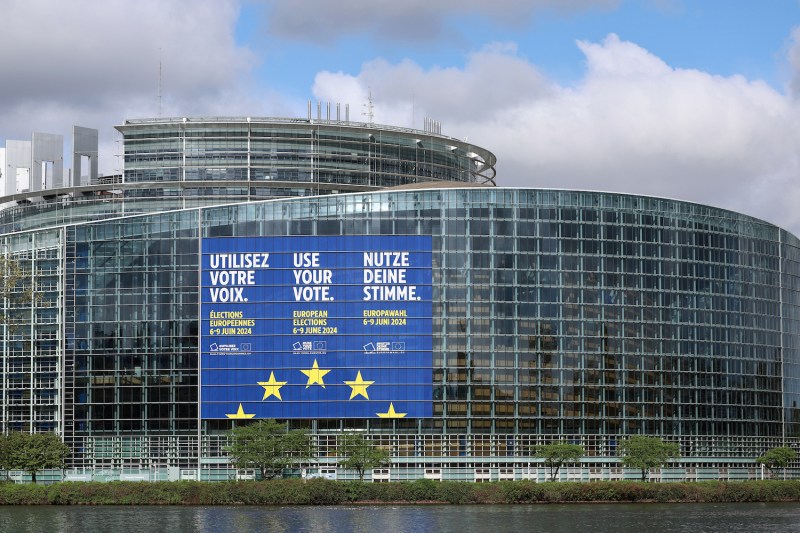 A poster announces upcoming European elections on the European Parliament building.
