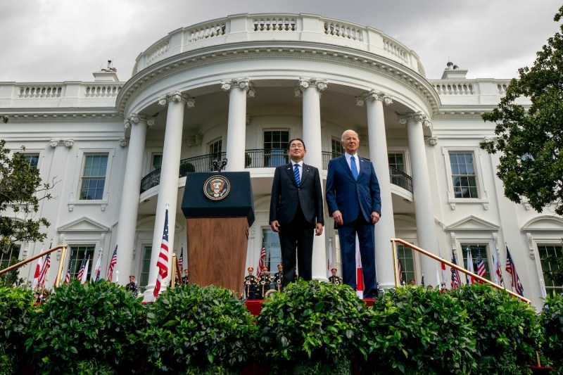 U.S. President Joe Biden and Japanese Prime Minister Fumio Kishida stand for their national anthems during an arrival ceremony at the White House in Washington, D.C.