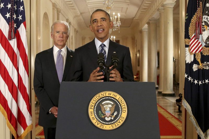 Then-U.S. President Barack Obama, standing with then-Vice President Joe Biden, holds a press conference about the Iran nuclear deal at the White House in Washington on July 14, 2015.