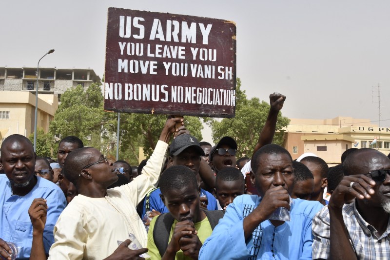 Protesters hold up a sign demanding that U.S. soldiers leave Niger during a demonstration in Niamey, Niger on April 13.