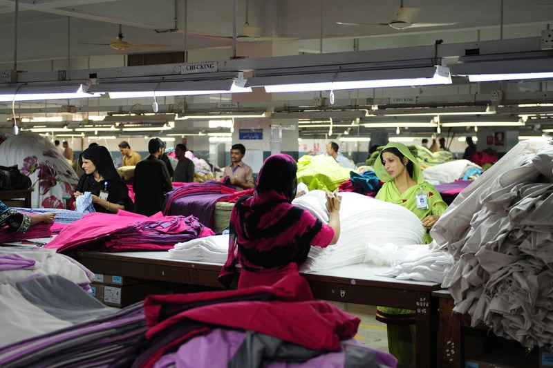 Employees work in a textile factory in Karachi, Pakistan.