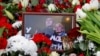 FILE PHOTO: Mourners come to grave of Russian opposition leader Alexei Navalny