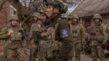 Ukrainian infantry soldiers of the 23rd Mechanized Brigade wait to head toward the frontline in the Avdiivka direction, in the Donetsk region, on April 3, 2024. (Roman Pilipey/AFP)