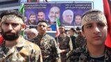 Iranians attend the funeral of seven Revolutionary Guards Corps members killed in a strike on the country's consular annex in Damascus, which Tehran blamed on Israel, on April 5, during their funeral procession in Tehran.