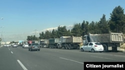 Iranian truck drivers protest along the Babayi highway in Tehran over a government cut in their monthly fuel quotas.