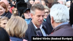 Peter Magyar speaks with protesters in Budapest. (file photo)