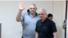 Armenia - Former Vanadzor Mayor Mamikon Aslanian (left) greets supporters during his trial in Yerevan, June 15, 2023.