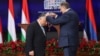 Bosnian Serb leader Milorad Dodik (right) presents an award to Hungarian Prime Minister Viktor Orban in Banja Luka on April 5. 