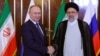 Iranian President Ebrahim Raisi (right) welcomes Russian President Vladimir Putin in Tehran on July 19, 2022. 