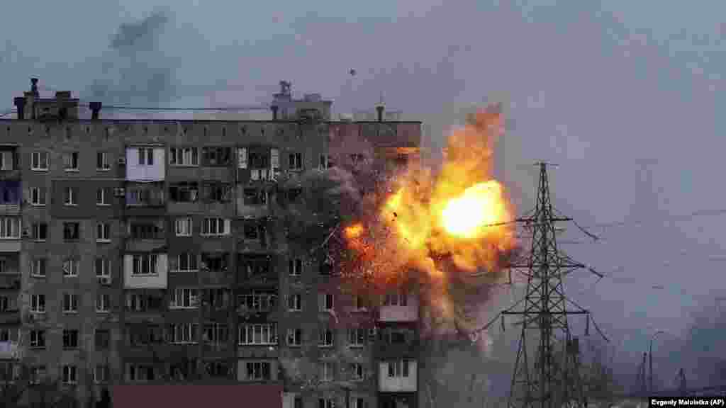 Ukraine -- An apartment building explodes after a Russian army tank fires in Mariupol