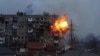 UKRAINE – An apartment building explodes after a Russian army tank fires in Mariupol, March 11, 2022