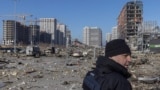 UKRAINE - Ukrainian serviceman secures the site of a bombing at a shopping center, in Kyiv, March 21, 2022