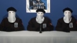 Spain -- ETA militants dressed in black shirts with white hoods over the heads and black berets making a declaration in an undisclosed location, 20Oct2011