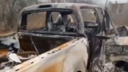 Уничтоженный выстрелом из гранатомета автомобиль семьи Видковских