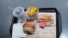 Продукция ресторана быстрого питания "Вкусно - и точка". Кетчуп производства "Макдоналдс" с закрашенным от руки логотипом компании