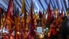 People visit graves of their relatives at a military cemetary in Lviv