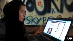 Afghanistan -- An Afghan ethnic Hazara woman browses the Facebook website at the Young Women For Change internet cafe, Afghanistan's first women-only net cafe, in Kabul, July 22, 2012 