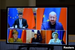 European Commission President Ursula von der Leyen (bottom right), European Council President Charles Michel (top right), German Chancellor Angela Merkel (bottom left), French President Emmanuel Macron (bottom center), take part in a videoconference with Chinese President Xi Jinping.