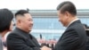 Лидер КНДР Ким Чен Ын и председатель КНР Си Цзиньпин 