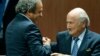 Switzerland -- UEFA President Michel Platini (L) congratulates FIFA President Sepp Blatter after he was re-elected at the 65th FIFA Congress in Zurich, Switzerland, May 29, 2015. 