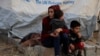 Сирийские беженцы в лагере для перемещенных лиц в Турции