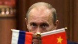 China -- Russian Prime Minister Vladimir Putin pauses during a news conference with China's Premier after a signing ceremony at the Great Hall of the People in Beijing, October 13, 2009