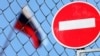 Generic – Flag of Russia behind a fence with a forbidding sign brick