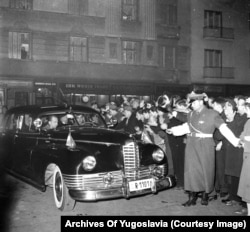 A car apparently carrying Tito arrives at a ball in Belgrade in 1960.