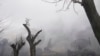 Дым над военно-воздушной базой в Мариуполе после российского удара