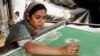 FILE - Naseema Akhtar does embroidery work at home in a village in West Bengal. During the first COVID-19 lockdown in 2020 she dropped out of school because her parents couldn't buy her a smartphone for online classes and became an embroidery worker. (Shaikh Azizur Rahman/VOA)